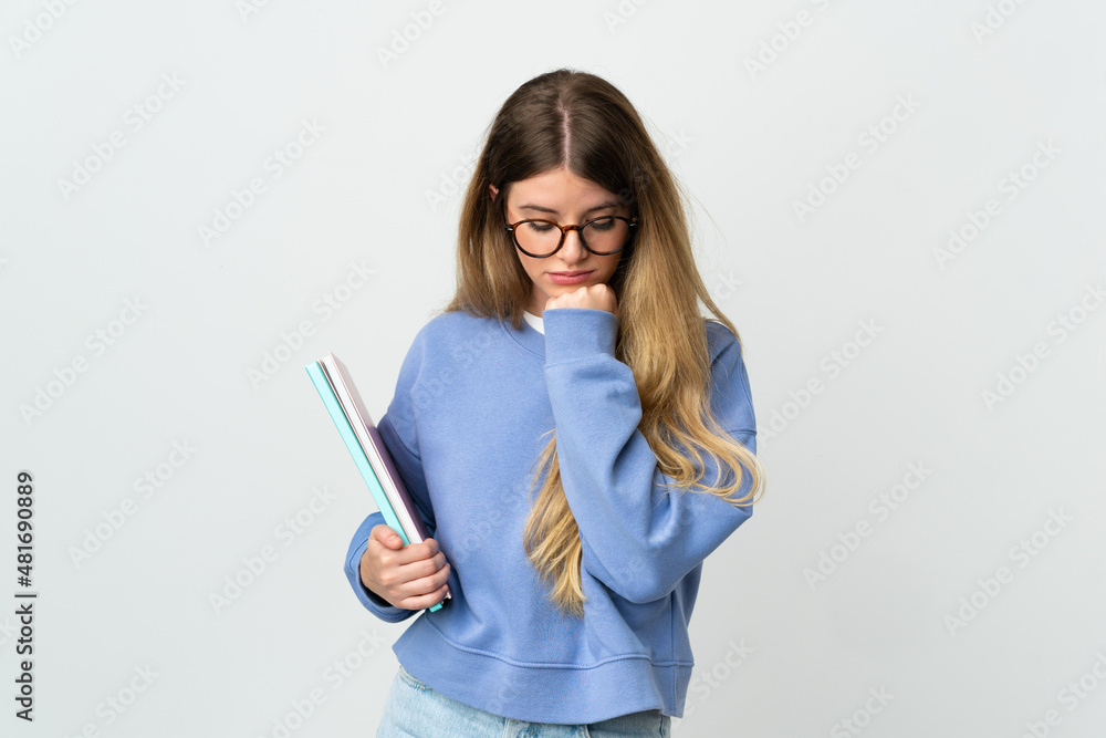 Young blonde student woman isolated on white background having doubts Young blonde student woman isolated on white background having doubts