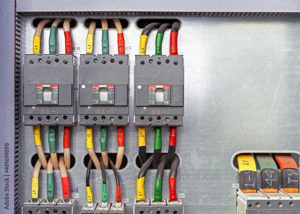 Electrical switchboard with different colored wires and sensors. Electricity equipment.