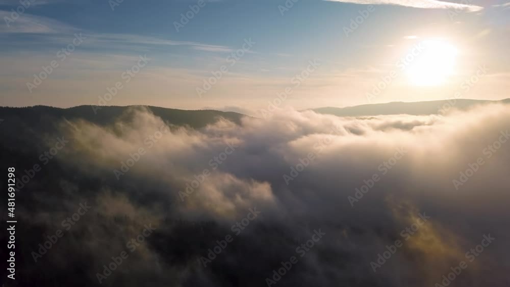 Foggy clouds heaven motion above forest nature in sunny autumn morning landscape Foggy clouds heaven motion above forest nature in sunny autumn morning landscape