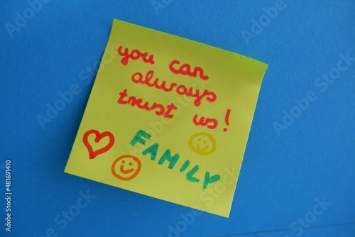 you can always trust us! Family paper note on blue wall