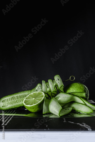 Принти на полотні green beans lime cucumber black background