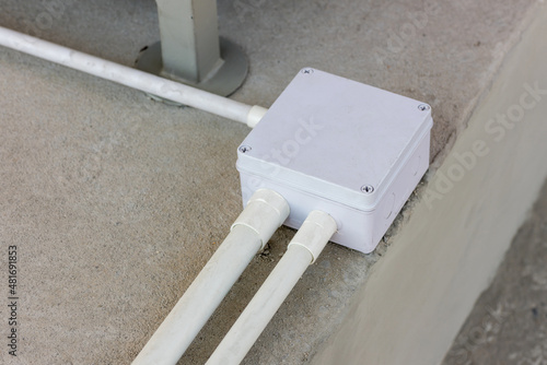 Fotografi Square Flooring box with plastic pipes and electric cables