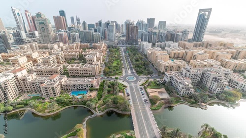 Skyscrapers in Barsha Heights district and low rise buildings in Greens district aerial timelapse. Dubai skyline photo