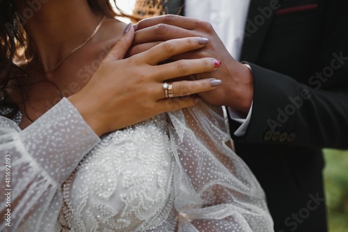 Hands of the bride and groom close-up