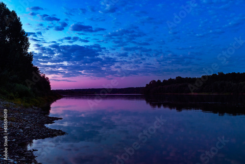 calm vyatka river at sunset on a summer evening