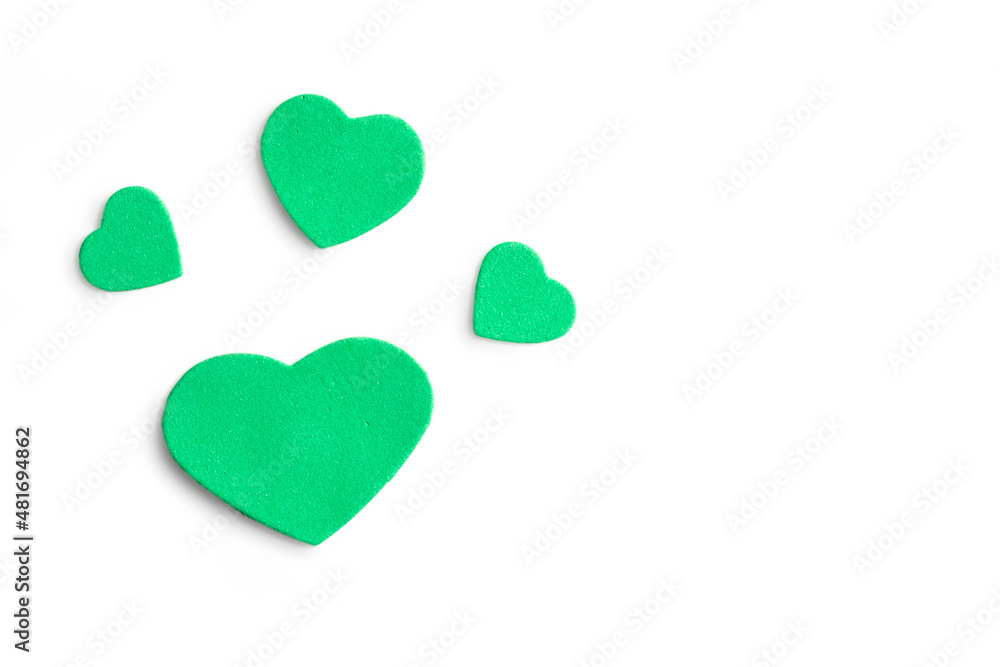 Valentine's Day. Isolated green hearts on a white background, top view, copy space Valentine's Day. Isolated green hearts on a white background, top view, copy space