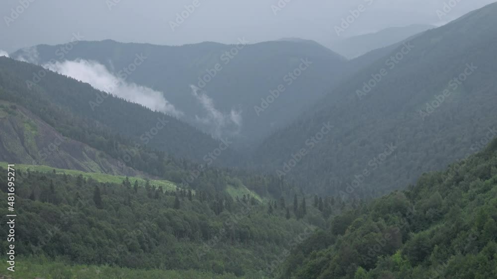 Mountain landscape with green valleys. Mountain valleys in the fog. Caucasian State Natural Biosphere Reserve named after Kh.G. Shaposhnikov. Oshten mountain slopes. Mountain landscape with green valleys. Mountain valleys in the fog. Caucasian State Natural Biosphere Reserve named after Kh.G. Shaposhnikov. Oshten mountain slopes.