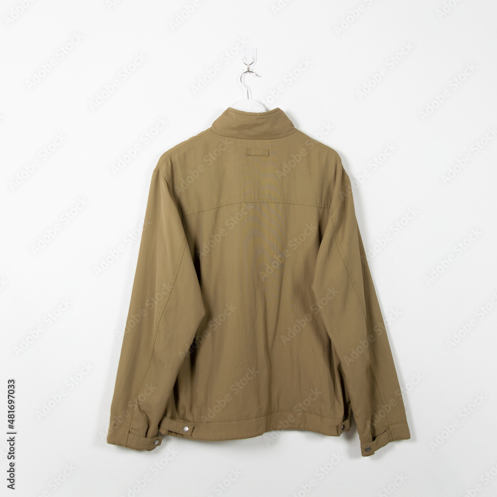 Blank clothes hanging in center empty white wall. Clear label mockup with highly detailed texture materials. Square. Blank clothes hanging in center empty white wall. Clear label mockup with highly detailed texture materials. Square.