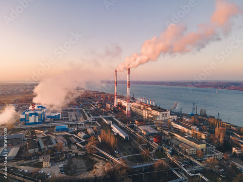 Industrial factory smokestack emission carbon gases and in atmosphere. Industry zone  factory smoke plumes. Climate change  ecology and global warming