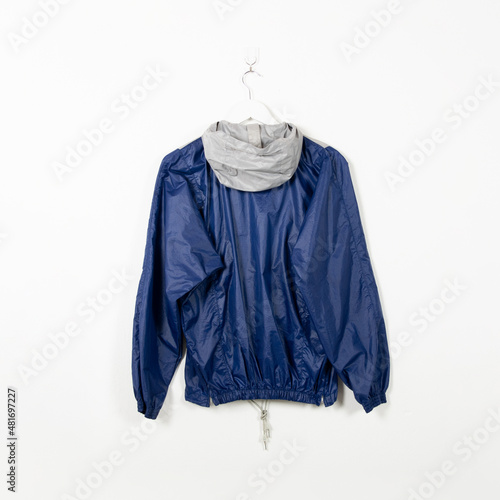 Blank clothes hanging in center empty white wall. Clear label mockup with highly detailed texture materials. Square. 