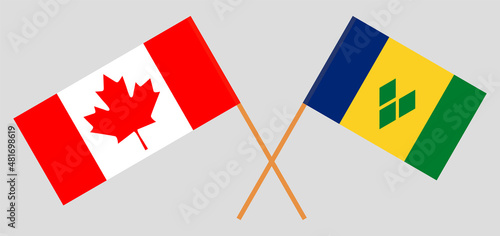 Crossed flags of Canada and Saint Vincent and the Grenadines. Official colors. Correct proportion