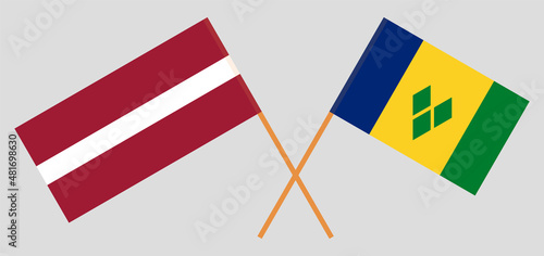 Crossed flags of Latvia and Saint Vincent and the Grenadines. Official colors. Correct proportion photo