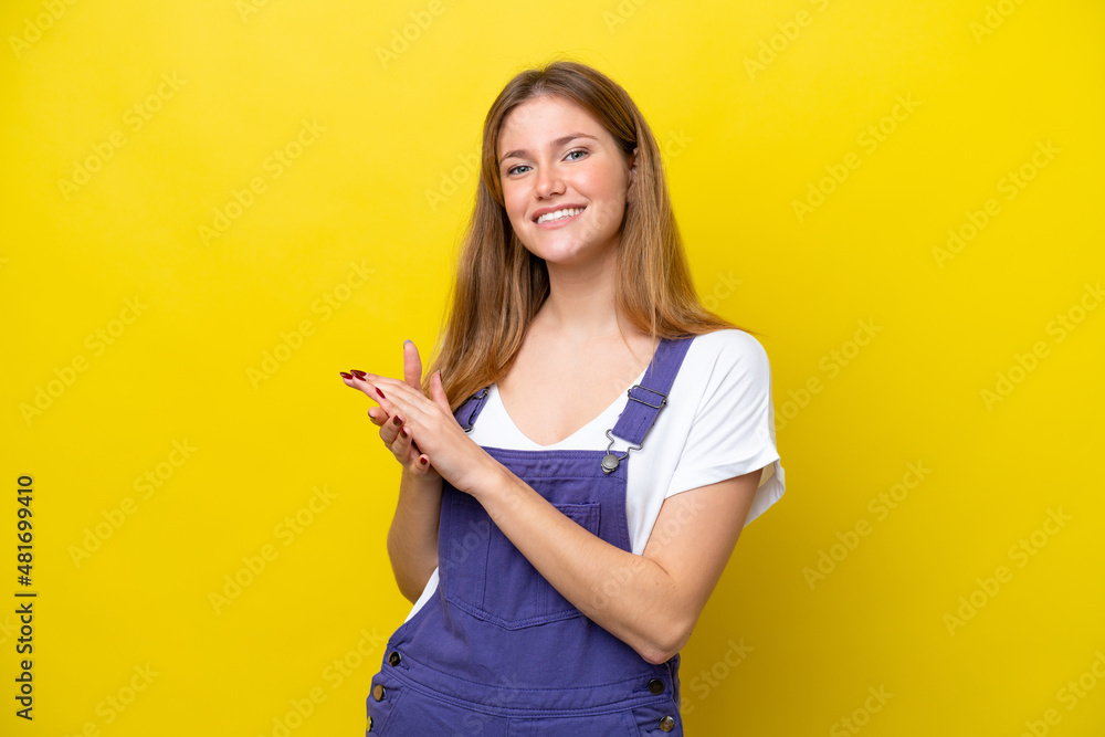 Young caucasian woman isolated on yellow background applauding Young caucasian woman isolated on yellow background applauding