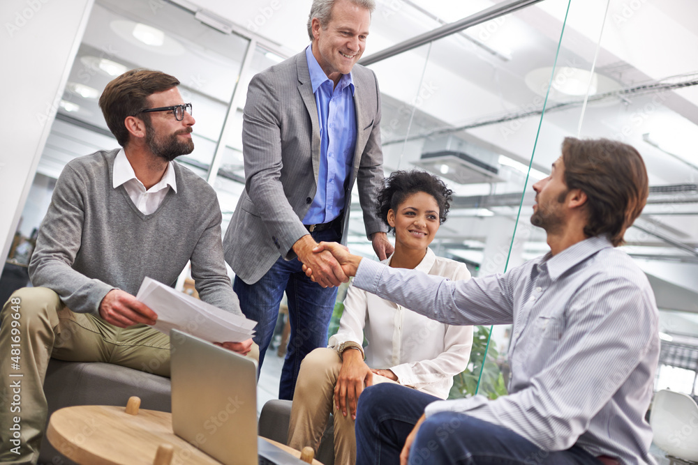 You've done well. Shot of a two business professionals shaking hands in an office. You've done well. Shot of a two business professionals shaking hands in an office.