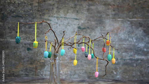 Easter dekorative eggs on tree branches.