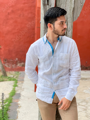 Model wearing an elegant white guayabera