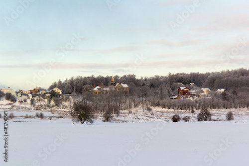A village was visible beyond the winter fields