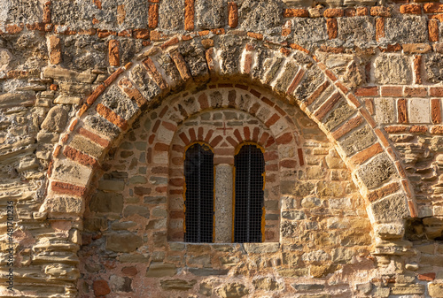 Close up of an old romano-gothic church window  © Yuliia