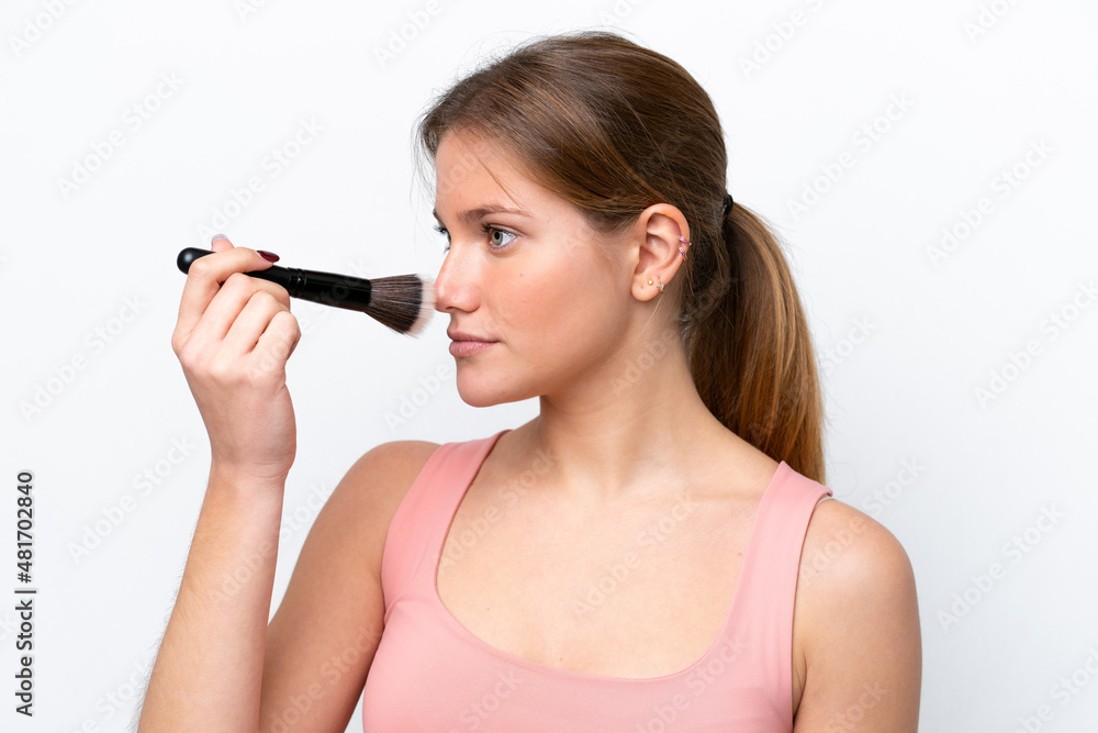 Young caucasian woman isolated on white background holding makeup brush Young caucasian woman isolated on white background holding makeup brush