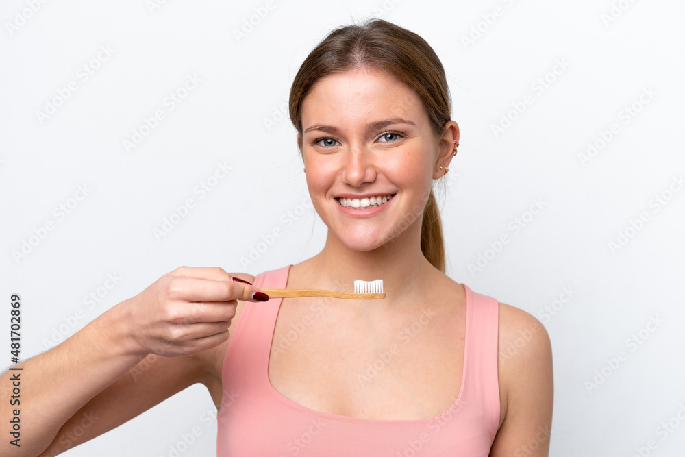 Young caucasian woman isolated on white background with a toothbrush and happy expression Young caucasian woman isolated on white background with a toothbrush and happy expression