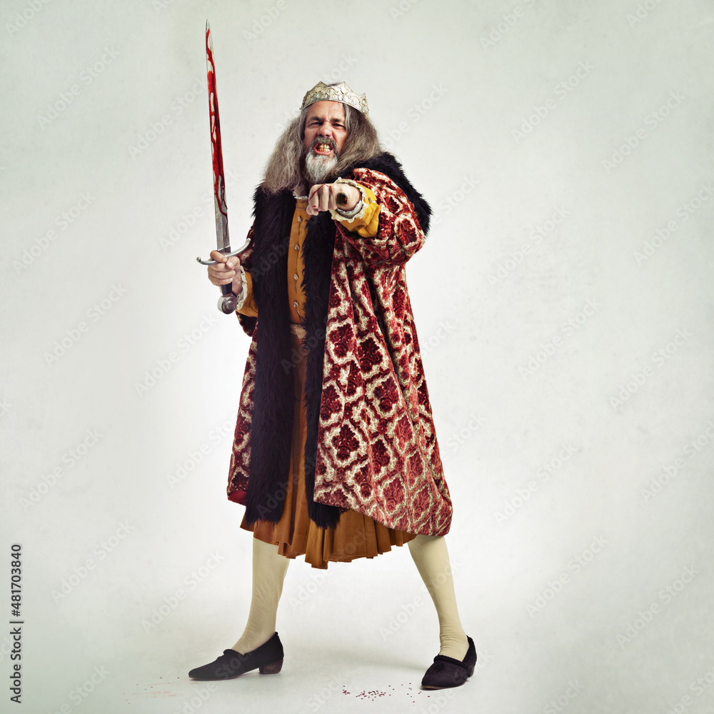 Care to taste my wrath. Studio shot of a richly garbed king. Care to taste my wrath. Studio shot of a richly garbed king.