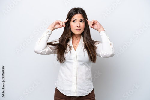 Young Brazilian woman isolated on white background having doubts and thinking