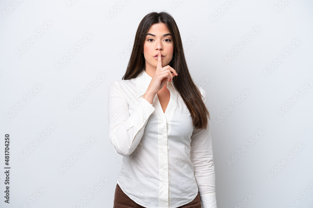Young Brazilian woman isolated on white background showing a sign of silence gesture putting finger in mouth Young Brazilian woman isolated on white background showing a sign of silence gesture putting finger in mouth