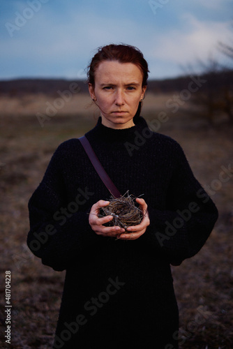 Woman holding a bird's nest