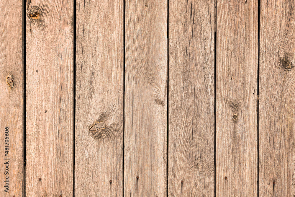 Fototapeta premium Vertical light brown wooden planks background
