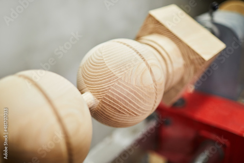 Obraz na plátně Wooden polished baluster on a lathe close up