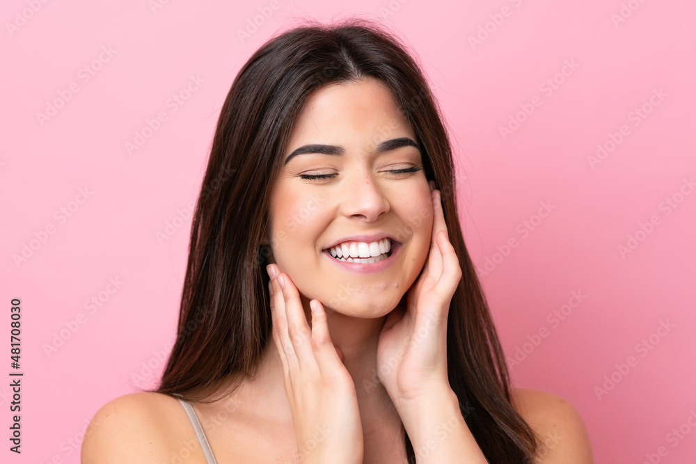 Young Brazilian woman isolated on pink background . Portrait Young Brazilian woman isolated on pink background . Portrait