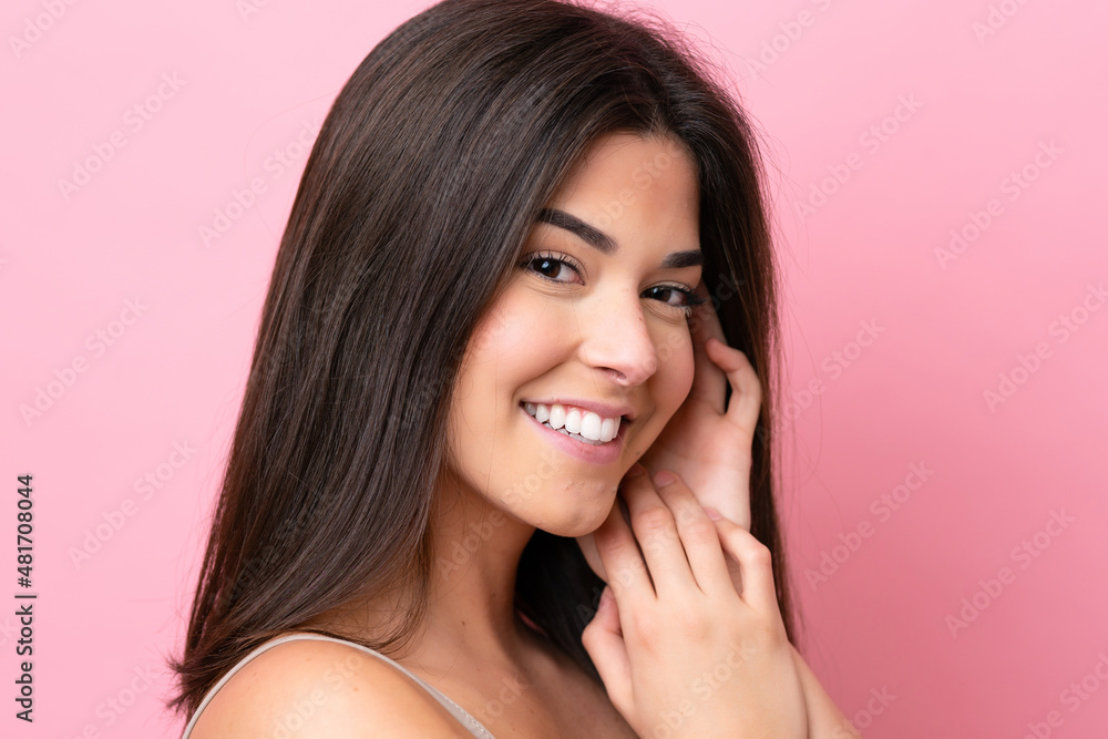 Young Brazilian woman isolated on pink background . Portrait Young Brazilian woman isolated on pink background . Portrait