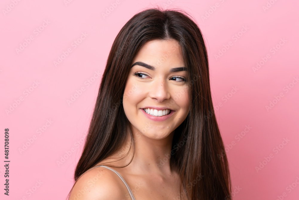 Young Brazilian woman isolated on pink background . Portrait Young Brazilian woman isolated on pink background . Portrait