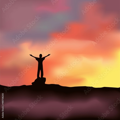 Silhouette of a man against a colorful sky