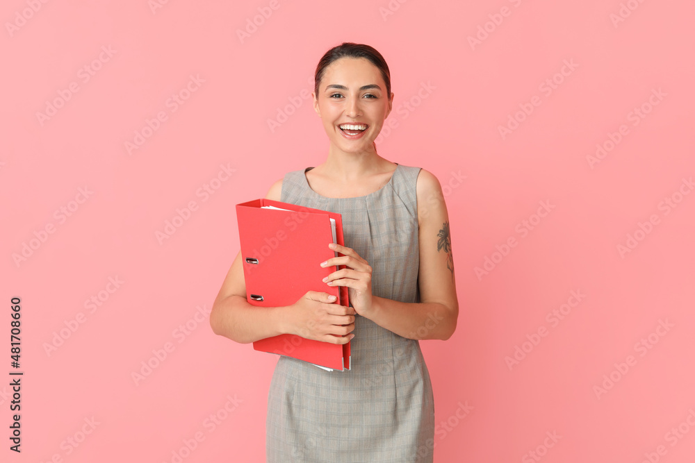 Beautiful young woman with folder on color background Beautiful young woman with folder on color background
