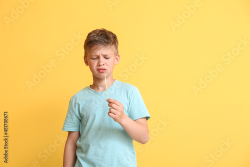 Displeased little boy in bl...