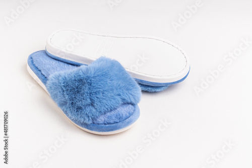 Blue women's home slippers. Space for text. Comfortable sole