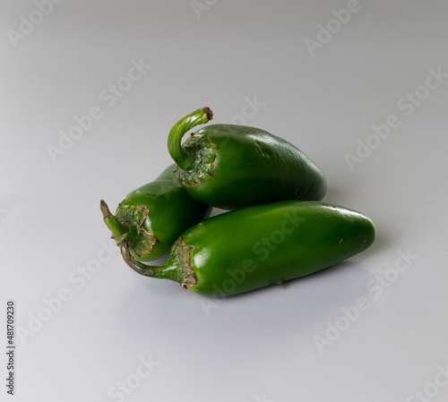 green chili peppers Grey Background