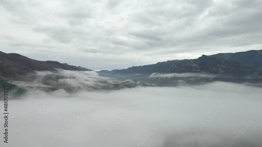 high mountains with snowy peaks above the clouds, aerial view high mountains with snowy peaks above the clouds, aerial view