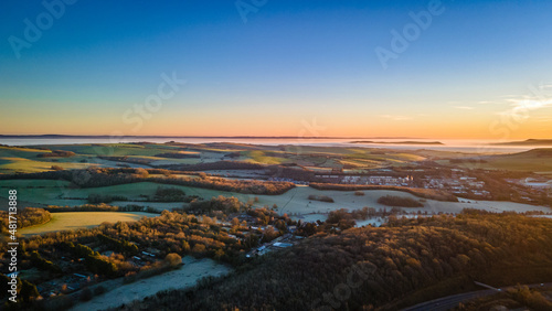 Aerial picture of foggy morning over the park, forest, West Sussex, UK