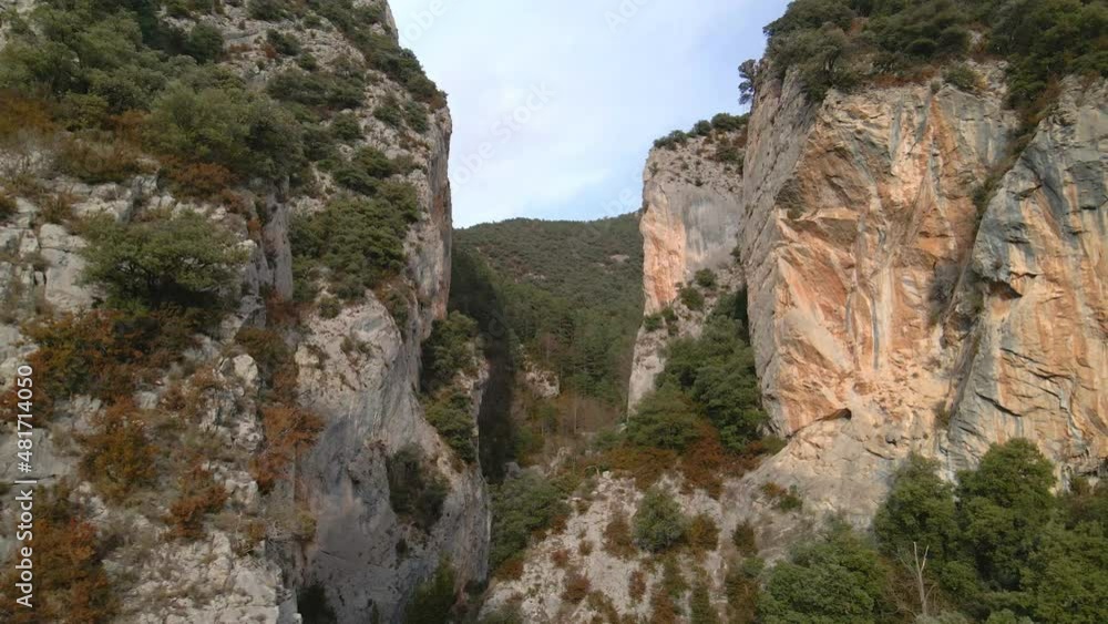 flight between two high mountains. Drone flies into a crevice between two rocks flight between two high mountains. Drone flies into a crevice between two rocks