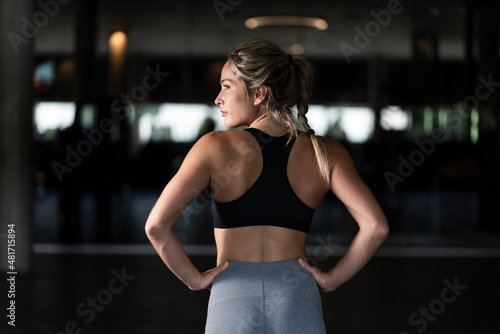 Strong blonde woman in an outdoor gym doing exercise © Marc Calleja