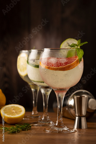 Three glasses of gin tonic cocktail on the table.