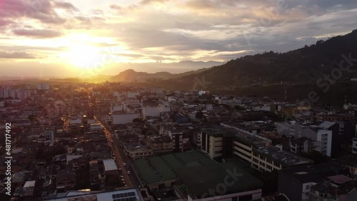 aerial shot rising from the city of Pereira Colombia at sunset photo