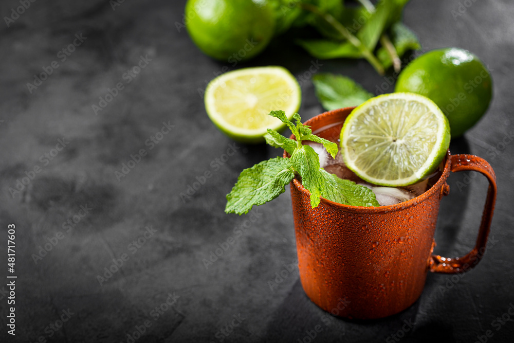 Fototapeta premium Moscow mule cocktail in copper mug on the table.
