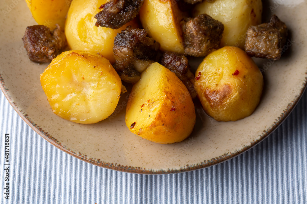 From traditional delicious Turkish food; potato and meat dish in casserole (Turkish name; Guvec tas kebabi, tandir) From traditional delicious Turkish food; potato and meat dish in casserole (Turkish name; Guvec tas kebabi, tandir)