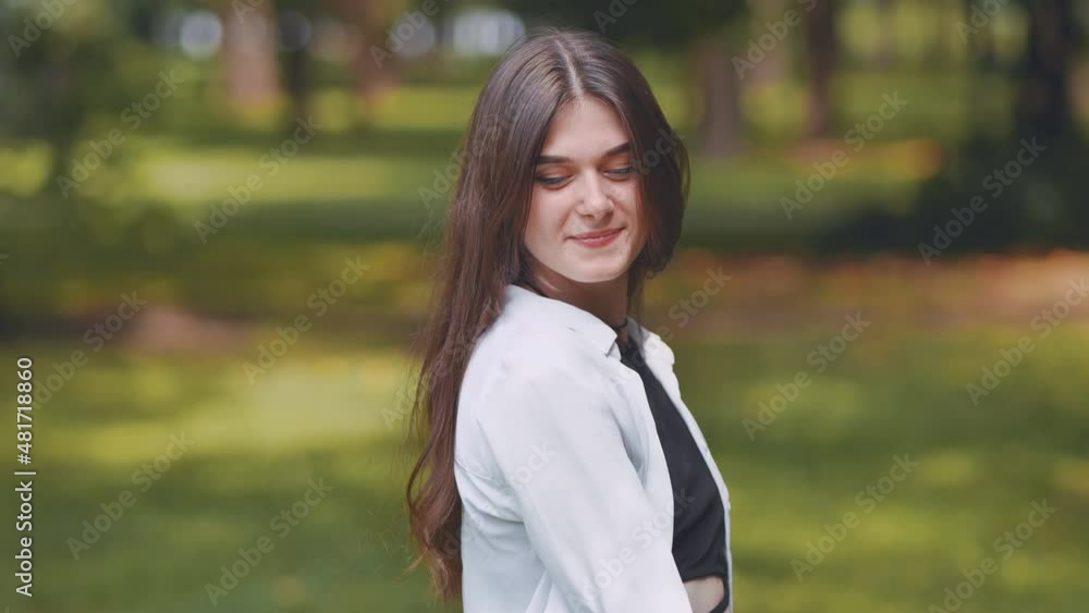Portrait of a smiling young Georgian girl in a park. Portrait of a smiling young Georgian girl in a park.