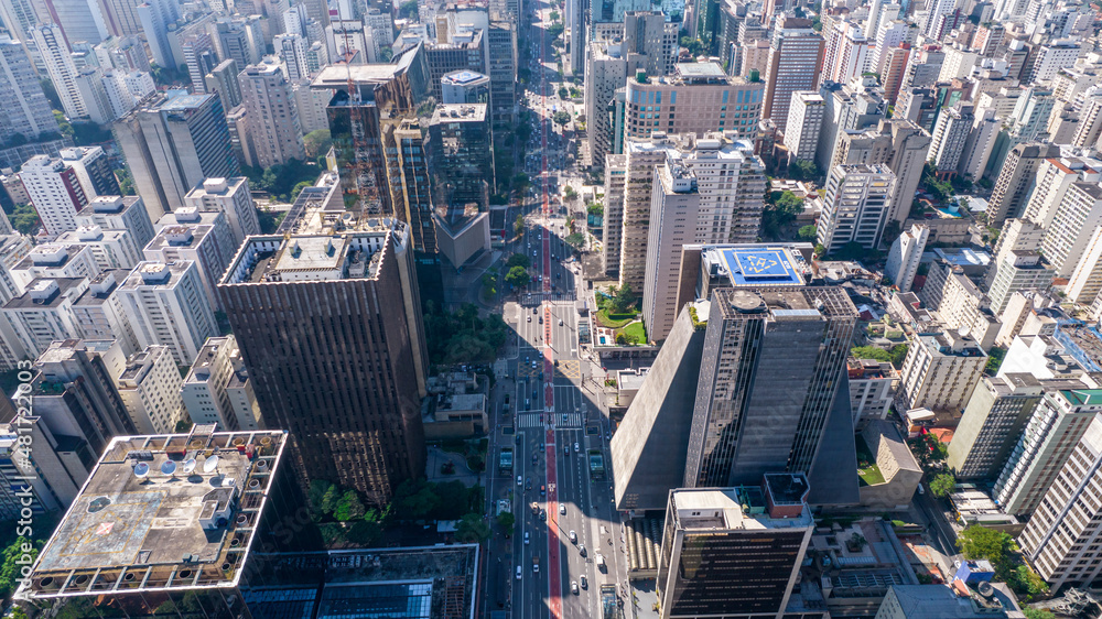Fototapeta premium Aerial view of Av. Paulista in São Paulo, SP. Main avenue of the capital. With many radio antennas, commercial and residential buildings. Aerial view of the great city of São Paulo.