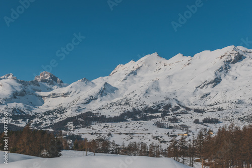 A picturesque landscape view of the French Alps mountains on a cold winter day (La Joue du Loup, Devoluy) © k.dei