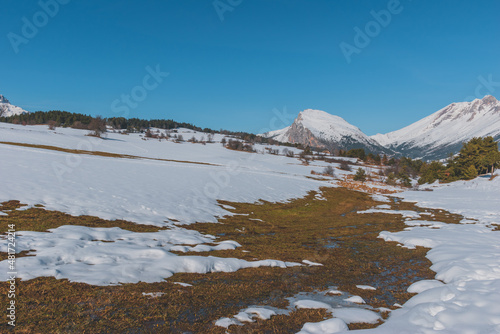 A picturesque landscape view of the French Alps mountains on a cold winter day (La Joue du Loup, Devoluy)